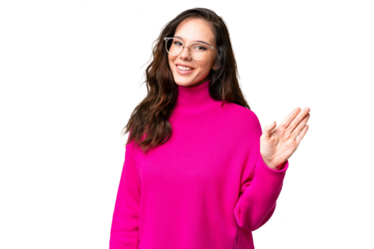 Young caucasian woman isolated over isolated background saluting with hand with happy expression - Powered by Adobe