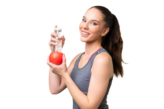 Young caucasian woman over isolated background with an apple and with a bottle of water