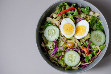 Healthy raw vegetable salad with boiled egg