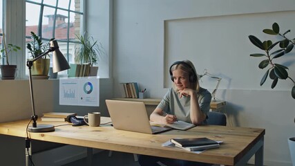 Animation of infographic interface. Young woman working on laptop with floating graphs in augmented interface. Business and technology concept. Communication network. GUI (Graphical User Interface) - Powered by Adobe