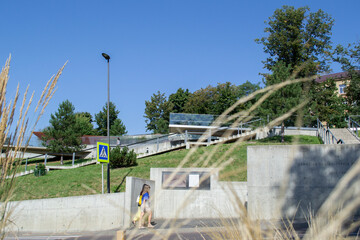 landscape design with stairs. people walking in the park