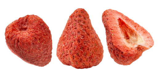 Three pieces of dried strawberries, one whole, one pointy, and a cross-section, showcasing their porous, crunchy texture and vibrant red color.