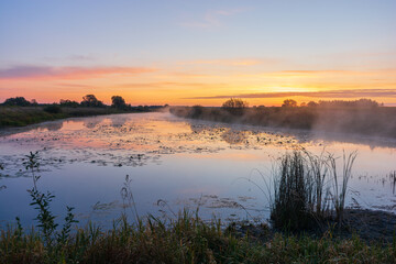 sunrise over the river with fog