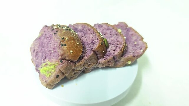 wholemeal bread resh buns with different seeds on white background. 