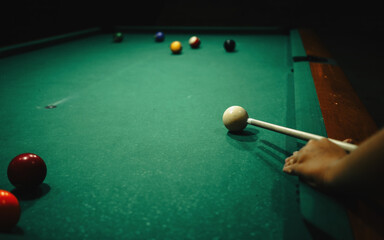 Playing pool in a night pub