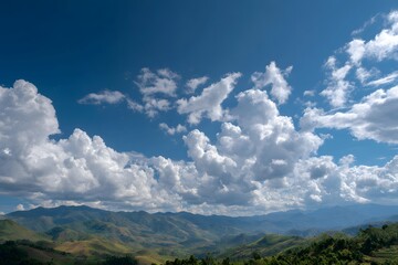 Rolling green hills under vast blue sky landscape mountains