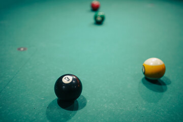 Billiard balls on the table, eight in focus
