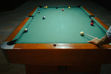 Playing pool in a night pub