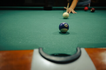Playing pool in a night pub