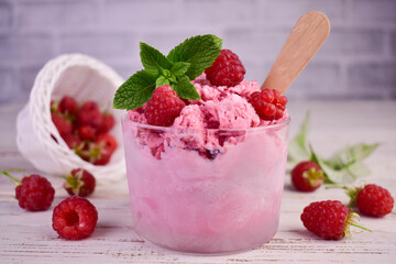 Summer raspberry ice cream with fresh raspberries, selective focus image

