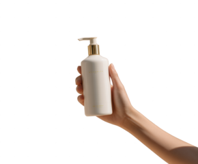 A hand is holding a bottle of lotion