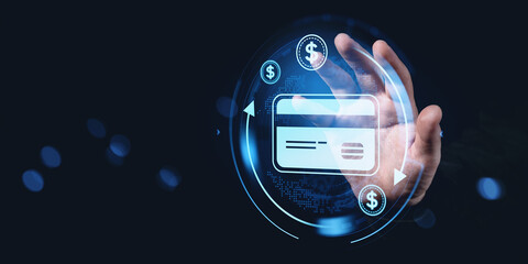 Hand touching digital interface with bank card and dollar icons in a futuristic style.