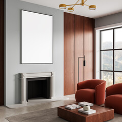 Modern interior design mockup with blank poster above fireplace in cozy living room with wood accents and red armchairs near large window view. 3D Rendering