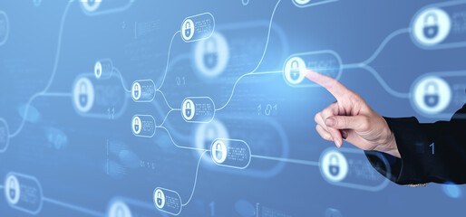 Digital hand interacting with blockchain lock icons on virtual interface for cybersecurity and data protection concept on blue background.
