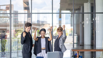 Business team from diverse cultures, genders, and generations celebrate the success hitting targets. Group of office workers express their appreciation to each other at the balcony. Cross generations