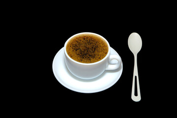 Coffee cup with saucer isolated on black background closeup view 