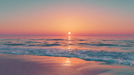 A serene sunset over the ocean, with gentle waves lapping at the sandy shore.