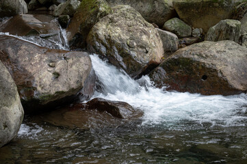 Close up of river flows between stone, in New Taipei City, Taiwan.