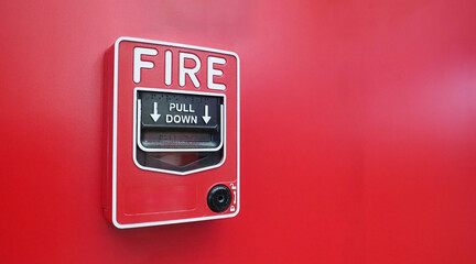 Fire alarm system notifier on red background.