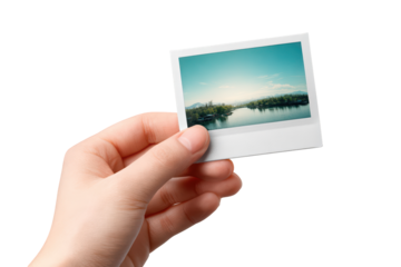Hand holding instant photo scenic lake view travel photography memories, isolated on transparent background, perfect cutout, PNG