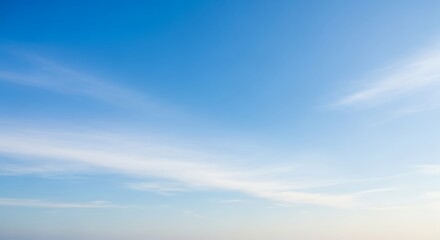 Obraz premium Stunning view of a clear blue sky with wispy clouds.