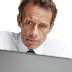 A man is sitting in front of a computer with a serious look on his face