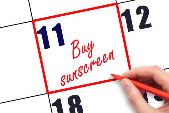 11 th day of the month.  Hand writing Buy sunscreen reminder and drawing red frame on calendar. Concept skin care, health care. Travel planning concept. Planning and scheduling