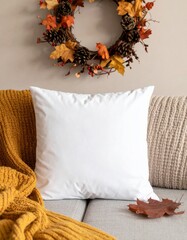 Autumn Home Decor with Wreath and Yellow Blanket on Beige Couch with Fall Color Leaves
