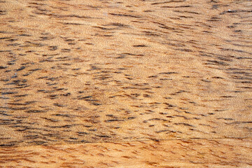 Mango wood texture top view. Kitchen wooden tray background, organic Mangifera indica veneer