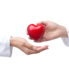 Fototapeta premium Hands exchanging a symbolic red heart, representing love, compassion, and care. Ideal for concepts of kindness, charity, and human connection.