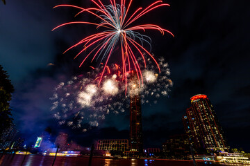 The blurred background of fireworks (light trails) is beautiful at night, seen in the New Year holidays, Christmas events, for tourists to take pictures during public travel.