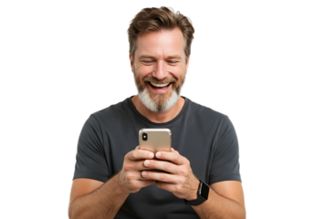 Smiling man with beard looking at his smartphone and laughing