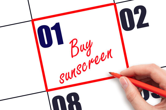 1 st day of the month.  Hand writing Buy sunscreen reminder and drawing red frame on calendar. Concept skin care, health care. Travel planning concept. Planning and scheduling