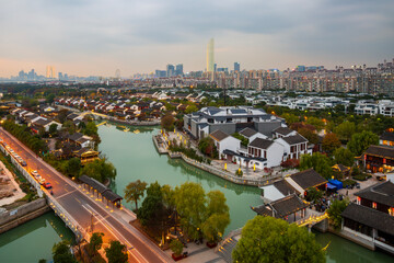 Obraz premium Xietang Old Street water town ancient architecture and modern city skyline in Suzhou, China