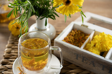 Herbal tea served with colorful flowers in a cozy setting, perfect for relaxation and enjoyment