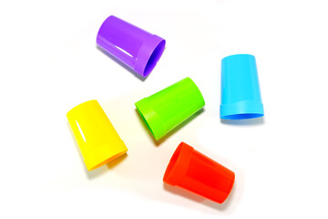 plastic tumblers layered together closeup view on white background 