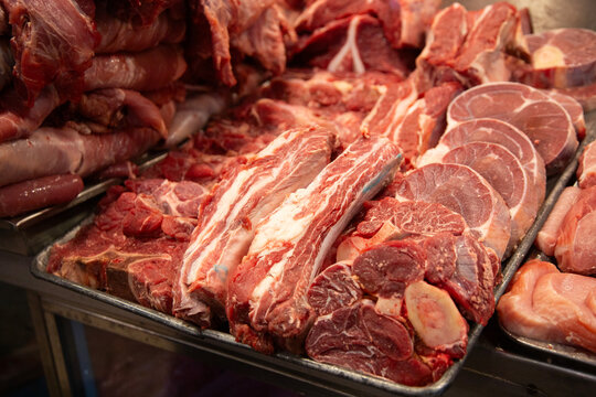 Mexico City, Mexico; November 1, 2025: Stalls selling fresh meat at the Mercado de la Merced market in Mexico City. - Powered by Adobe