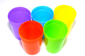 colorful plastic tumblers together closeup shot  