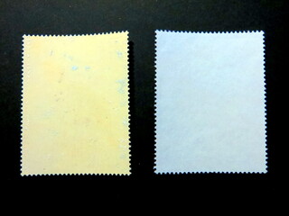 Fototapeta premium Exploration of Unique Postage Stamps Showcasing Their Reverse Sides in a Philatelic Collection