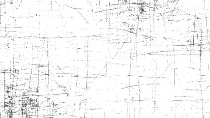 White surface with dark grey scratches and speckles lines