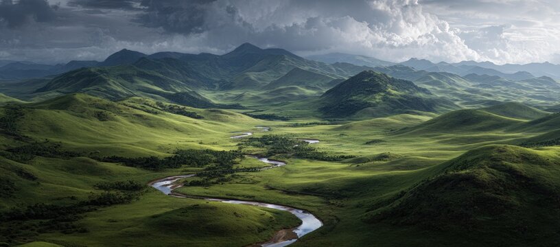 Lush valley, rolling hills under a dramatic sky