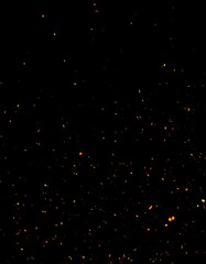 Dynamic Display of Fiery Orange Sparks Flying Upward Against a Black Background