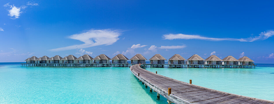 Top luxury water villas in Maldives islands under sunny blue sky with amazing ocean lagoon, tropical paradise resort and scenic summer vacation destination for travel, tourism relaxation inspiration