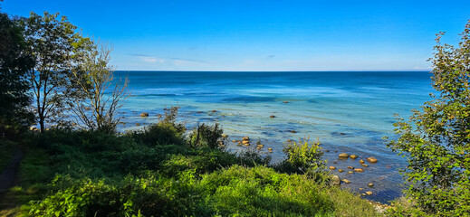 Baltic Sea Rocky Shoreline with Green Foliage