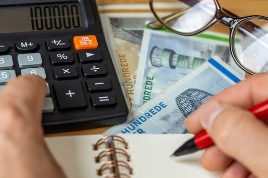 Financial settlements in Danish kroner, Financial analysis, Tax calculation, Risk costs, business project. Denmark money, close up