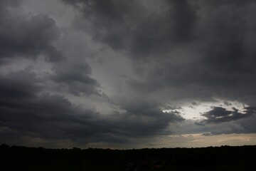 Clouds over the forest in summer
