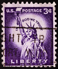 UNITED STATES OF AMERICA - CIRCA 1954.postage stamp printed in USA shows a picture of Statue of Liberty in a close-up containing the motto: "in god we trust", circa 1954