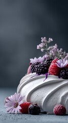 Raspberry and blackberry pavlova dessert on dark background