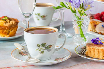 Fototapeta premium Coffee and selection of gourmet cakes set up on a table