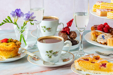 Coffee and selection of gourmet cakes set up on a table
